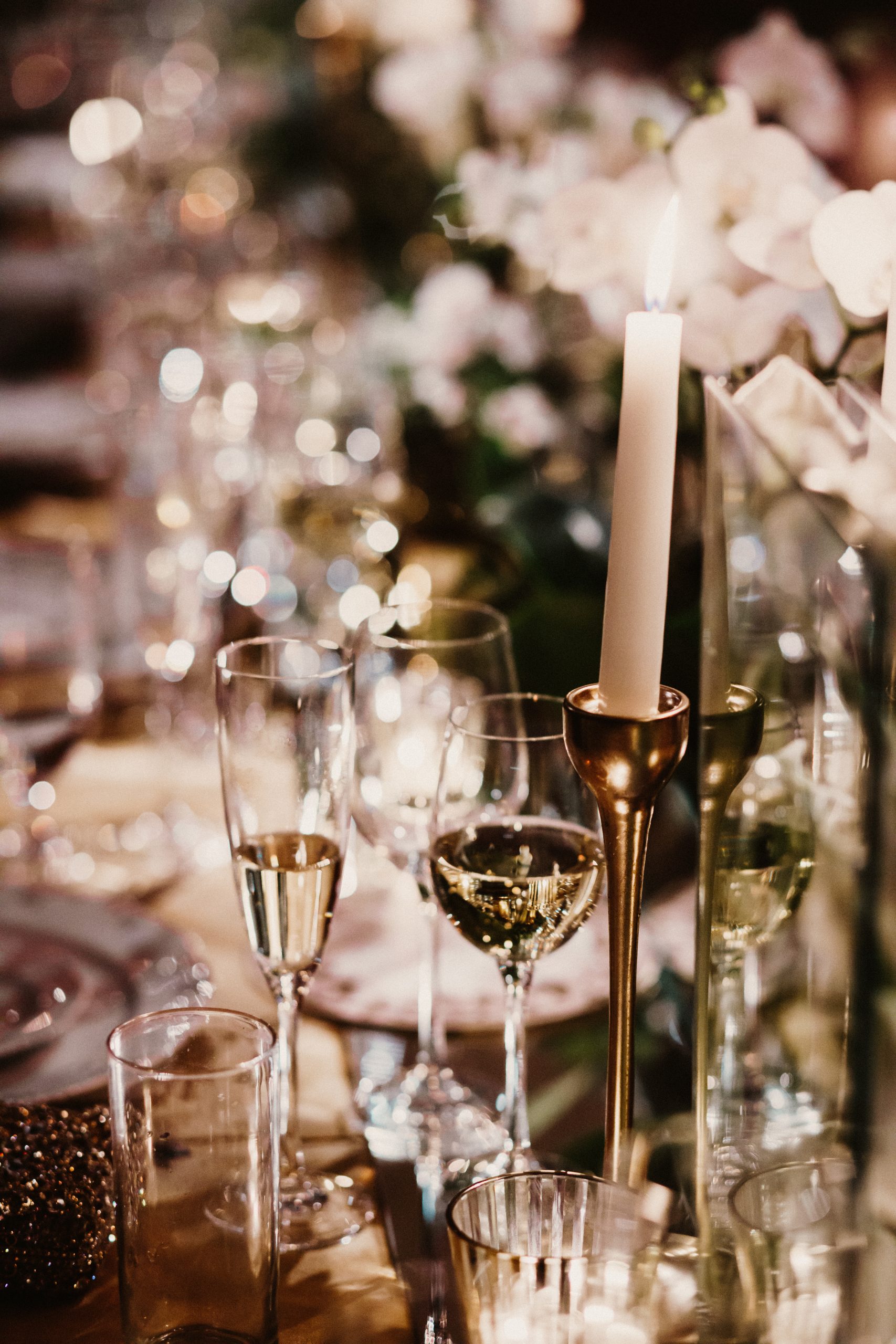 Glasses of champagne stand on a festive table